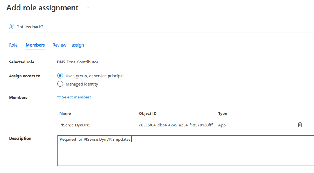 Image showing the 'Add role assignment, Members' screen.
Selected role is displaying static text of 'DNS Zone Contributor' as this is configured in a previous section, the 'Assign access to' radiobox is set to 'User, group, or service principal', there is one member showing within the members table, the name field says 'PfSense DynDNS', the object ID is displayed, the Type field says 'App'.
The description is set to 'Required for PfSense DynDNS updates'.